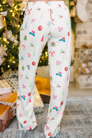 White pajama pants with festive Christmas print, featuring candy canes, ice skates, and cars.