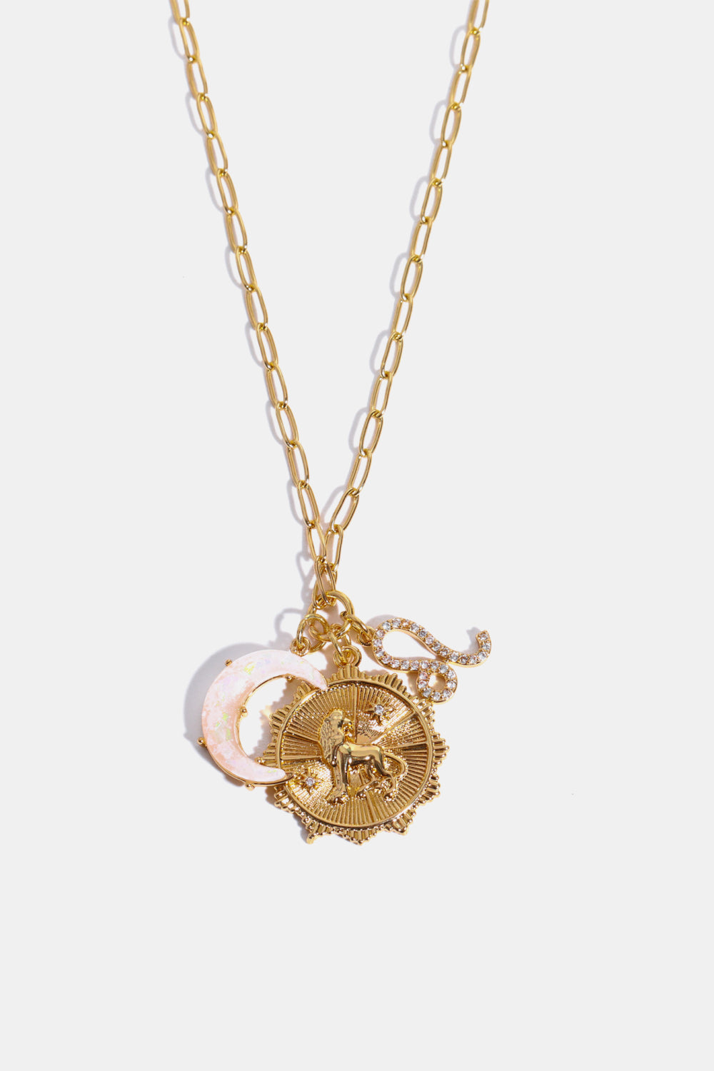 Gold celestial pendant necklace with Leo zodiac symbol, moon charm, and sun medallion.