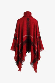 Deep Red plaid turtleneck cape with fringe detail and textured acrylic knit.