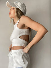 White ribbed crop top with cutout detail and racerback.