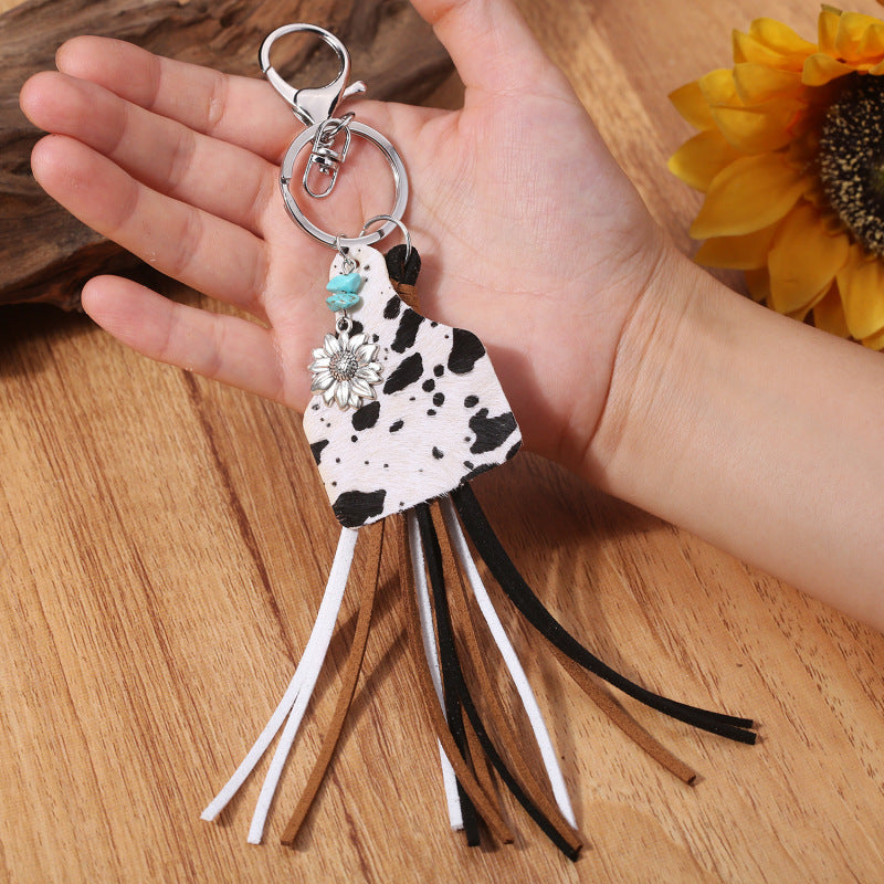 Leopard print tag keychain with flower charm and multi-color tassels