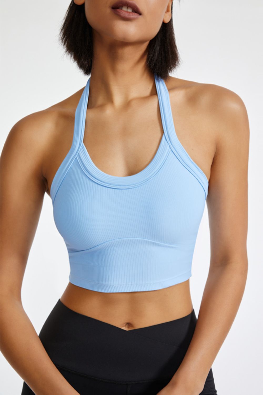 Light blue ribbed halter crop top with a scoop neckline and a fitted silhouette.