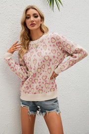 Drop shoulder sweater in Apricot with pink and yellow heart print, crew neck, long sleeves.