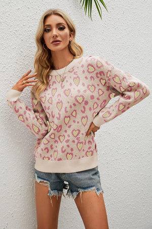 Drop shoulder sweater in Apricot with pink and yellow heart print, crew neck, long sleeves.