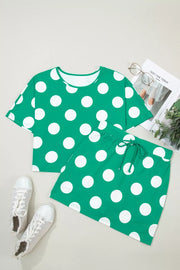Green polka dot cropped tee and skort set with drawstring detail.