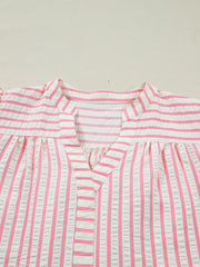 Pink and white striped seersucker blouse with V-neck and gathered yoke.