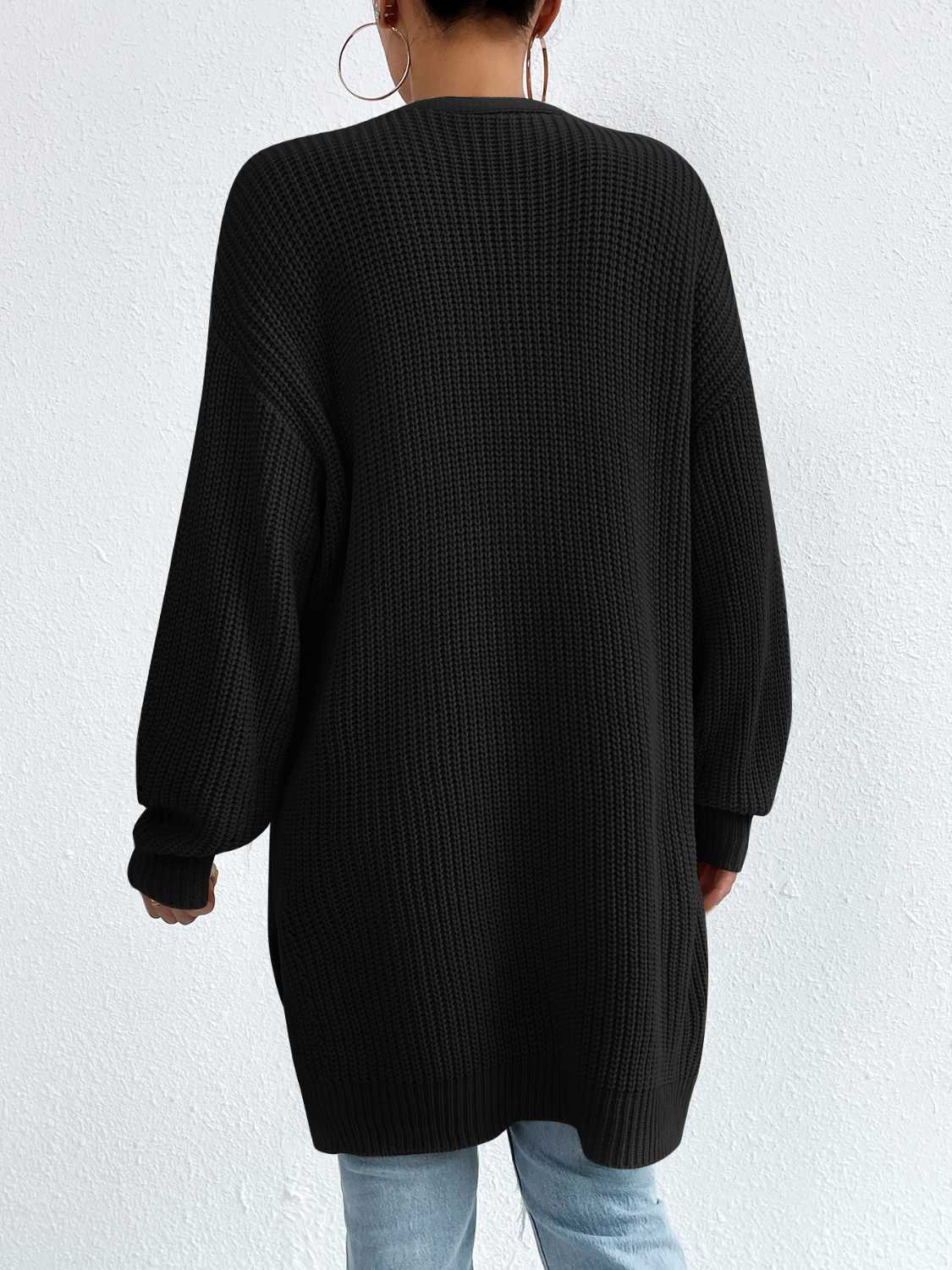 Longline black acrylic knit open cardigan with long sleeves and ribbed details.