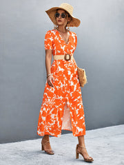 Orange-red floral print midi dress with puff sleeves, V-neck, and button front.