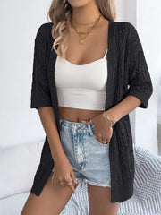 Black open-knit three-quarter sleeve cardigan with cable knit texture.