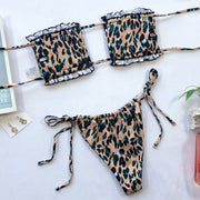 Leopard print bandeau bikini set with ruffled trim and tie sides.