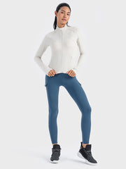 White ribbed performance zip-up jacket with thumbholes and mock neck