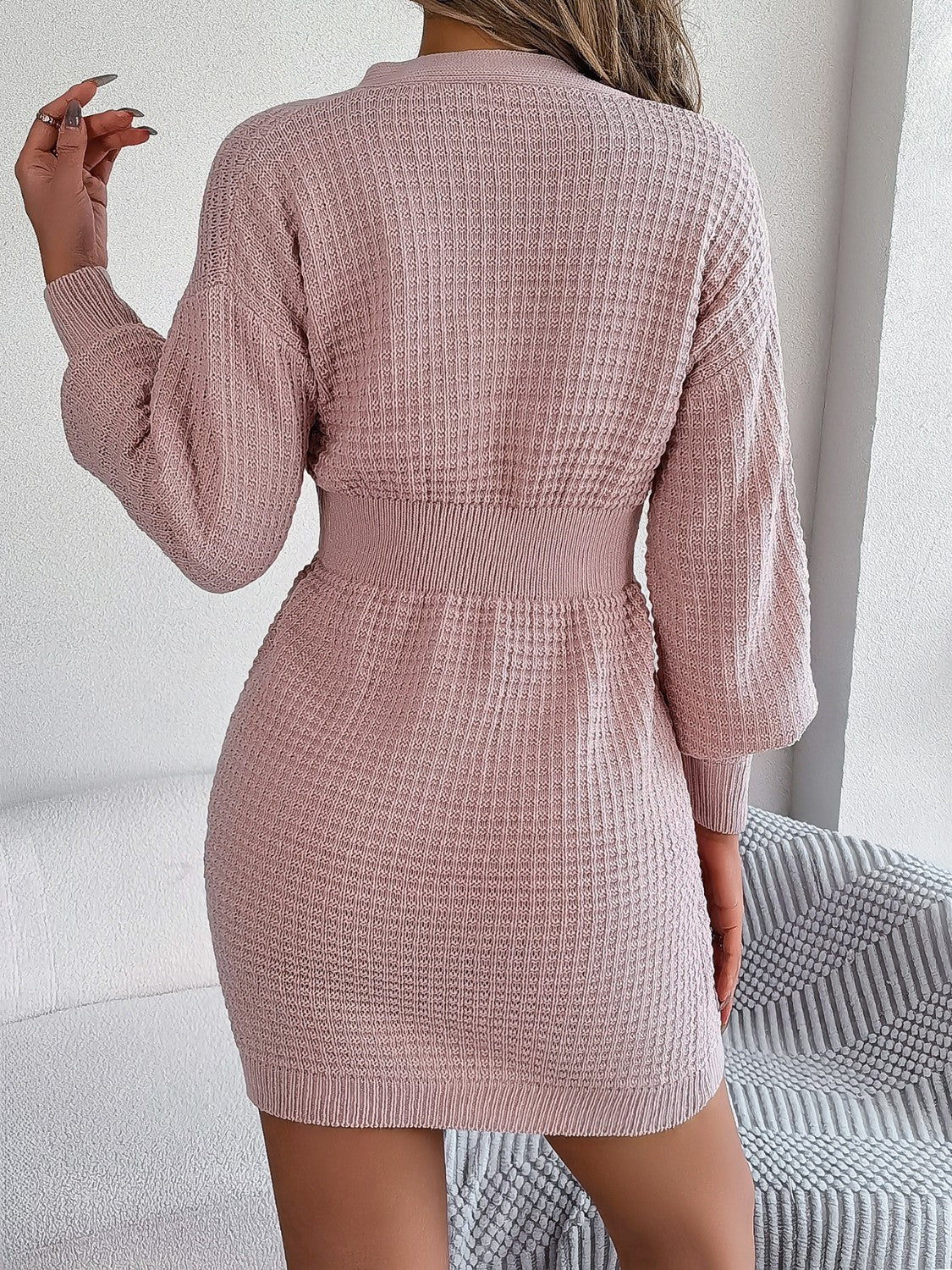 Blush pink cable knit dress with button front and hourglass silhouette