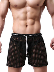 Black perforated sport shorts with white drawstring waist and waistband detail.