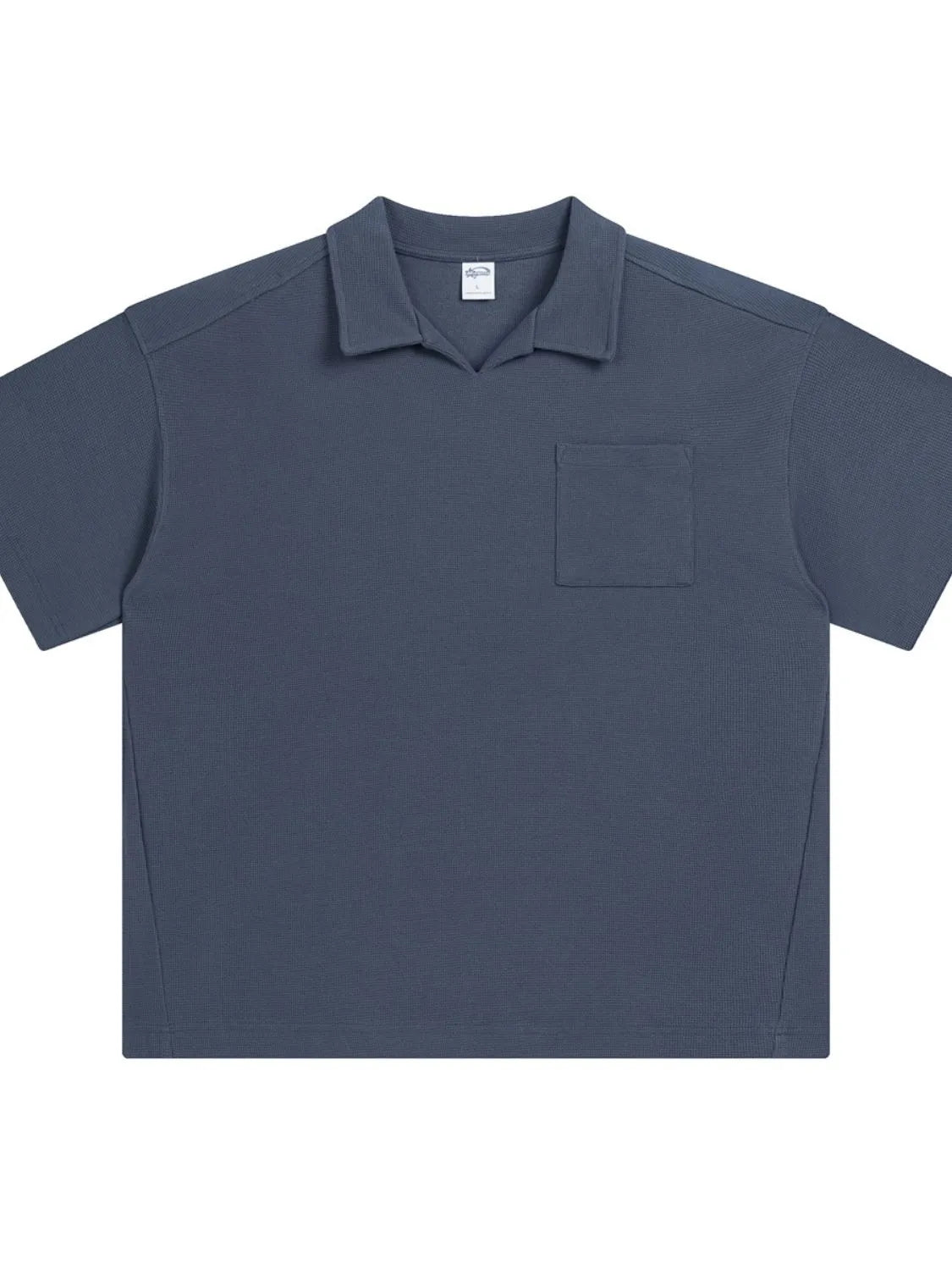 Boxy knit polo shirt in Dusty Blue with a patch pocket and spread collar.
