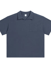 Boxy knit polo shirt in Dusty Blue with a patch pocket and spread collar.