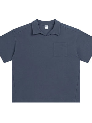 Boxy knit polo shirt in Dusty Blue with a patch pocket and spread collar.