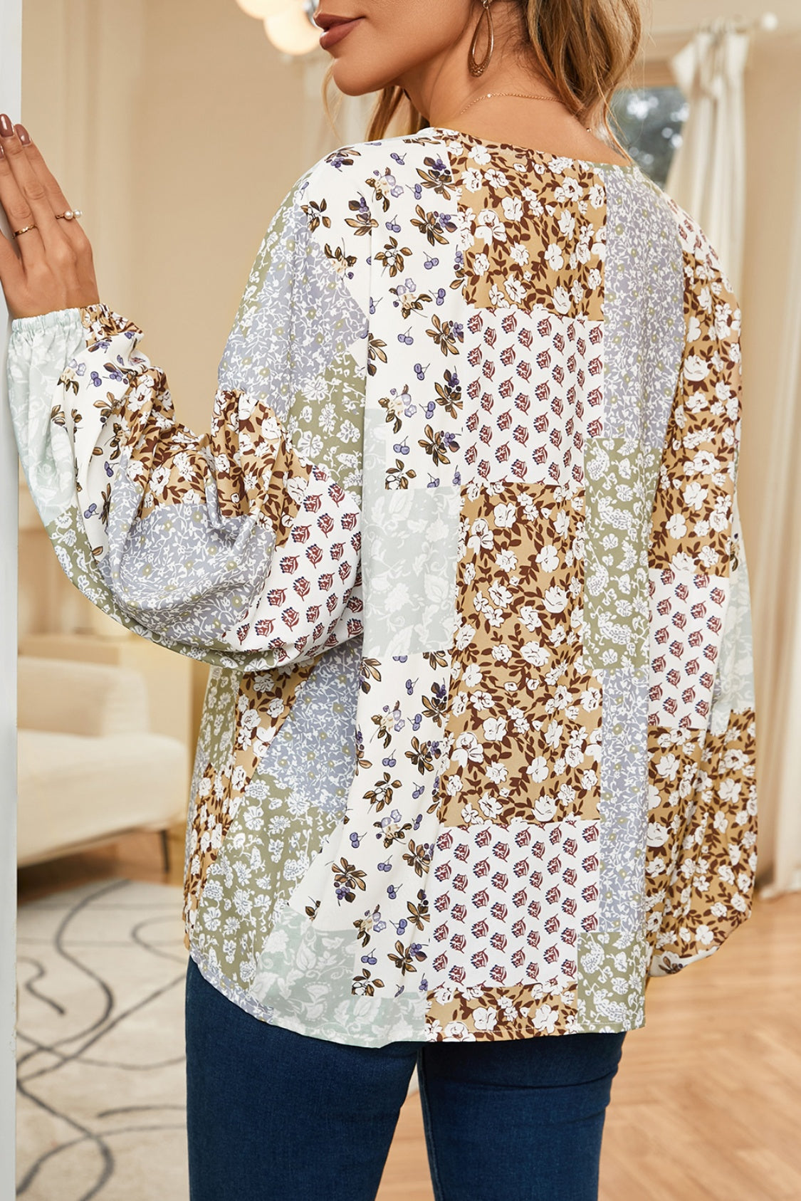 Patchwork floral button-down blouse with balloon sleeves and a V-neck.