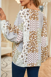 Patchwork floral button-down blouse with balloon sleeves and a V-neck.