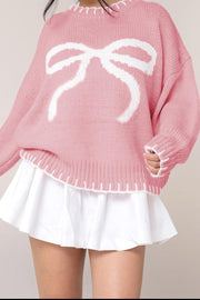 Blush pink acrylic knit crewneck sweater with white graphic bow detail and contrast stitching.