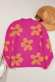 Cerise knit oversized sweater with an allover orange retro floral print.