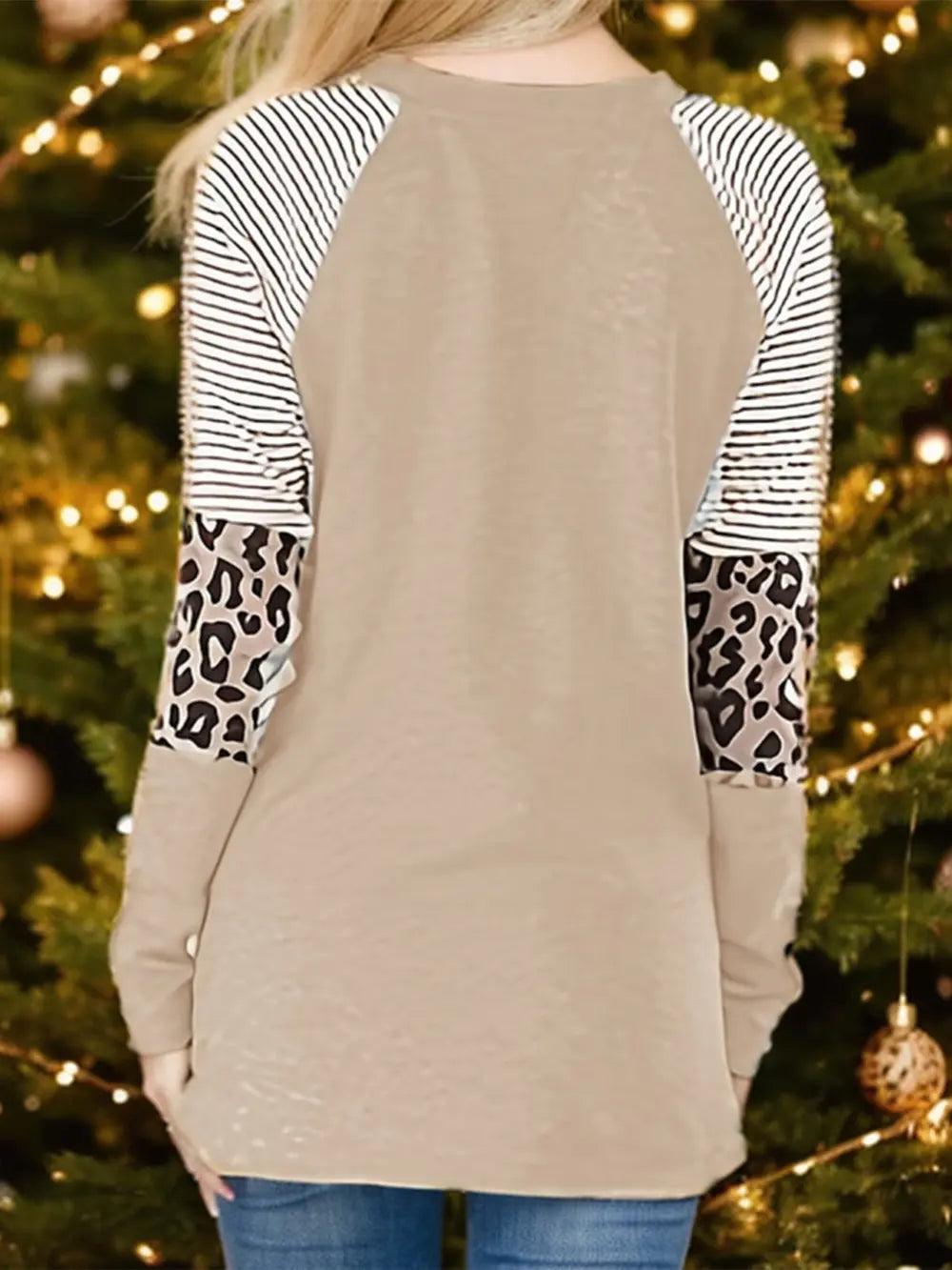 Tan raglan sleeve sweatshirt with black and white stripes and leopard print panels.