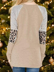 Tan raglan sleeve sweatshirt with black and white stripes and leopard print panels.