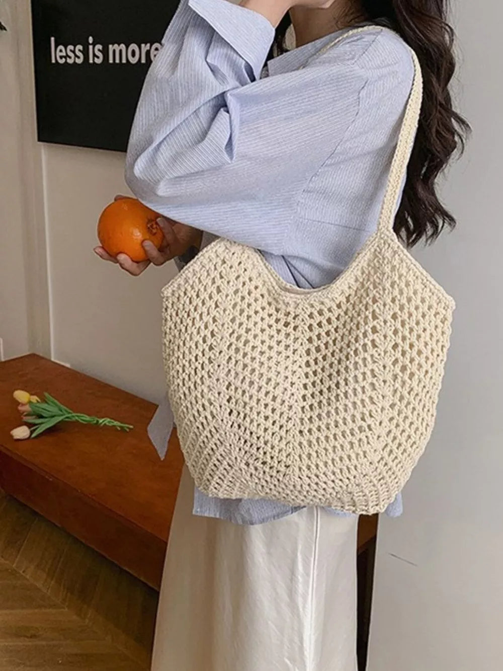 Chevron woven straw shoulder bag in rice white with braided straps and open crochet detail.