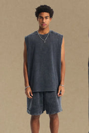 Acid wash dark gray relaxed fit tank top with crew neck and sleeveless cut.