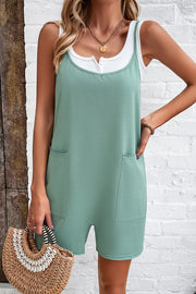 Light green relaxed romper with patch pockets and white henley tank top.