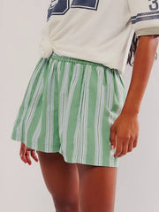 Light green striped shorts with elastic waistband and a relaxed fit.