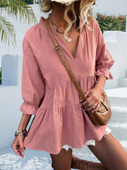 Tiered linen blouse in dusty pink with ruffled sleeves and V-neck