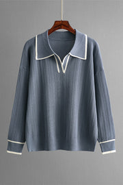 Dusty blue ribbed knit sweater with contrast trim on collar and cuffs.
