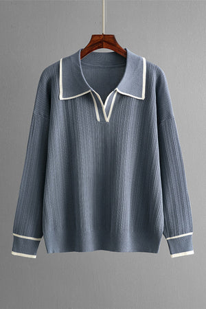 Dusty blue ribbed knit sweater with contrast trim on collar and cuffs.