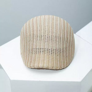 Beige textured striped beret with a breathable mesh knit pattern.