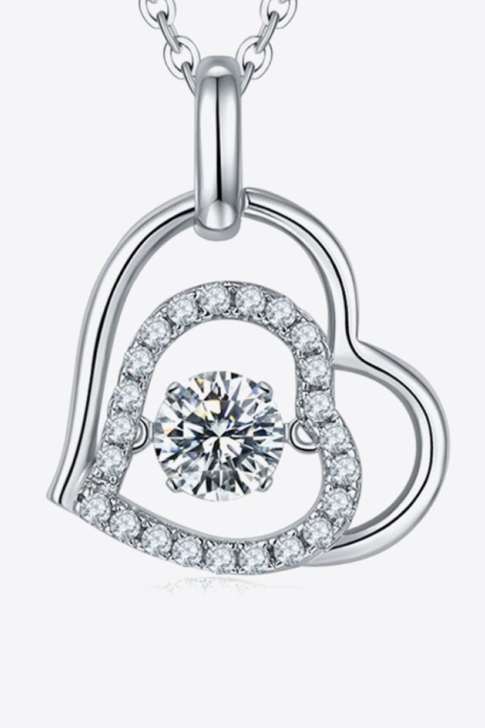 Silver floating heart necklace with pave diamond accents and a central sparkling stone.