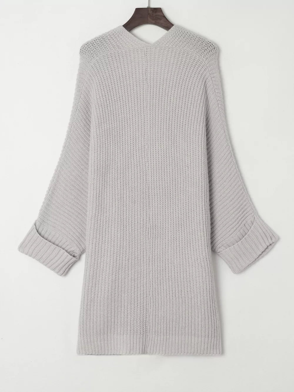 Light gray acrylic knit cardigan with open front, ribbed texture, and cuffed sleeves.