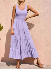 Lavender smocked bodice ruffled maxi dress with tiered skirt and square neckline.