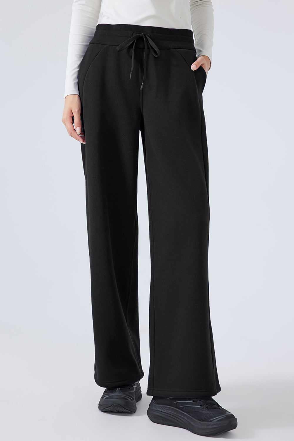 Black relaxed palazzo sweatpants with drawstring waist and pockets