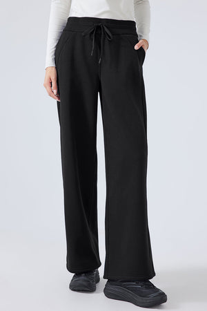 Black relaxed palazzo sweatpants with drawstring waist and pockets