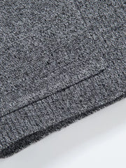Men's gray marled knit open-front cardigan detail, showing ribbed hem.