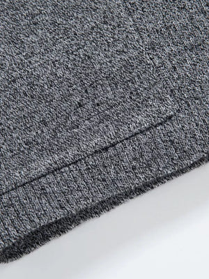 Men's gray marled knit open-front cardigan detail, showing ribbed hem.