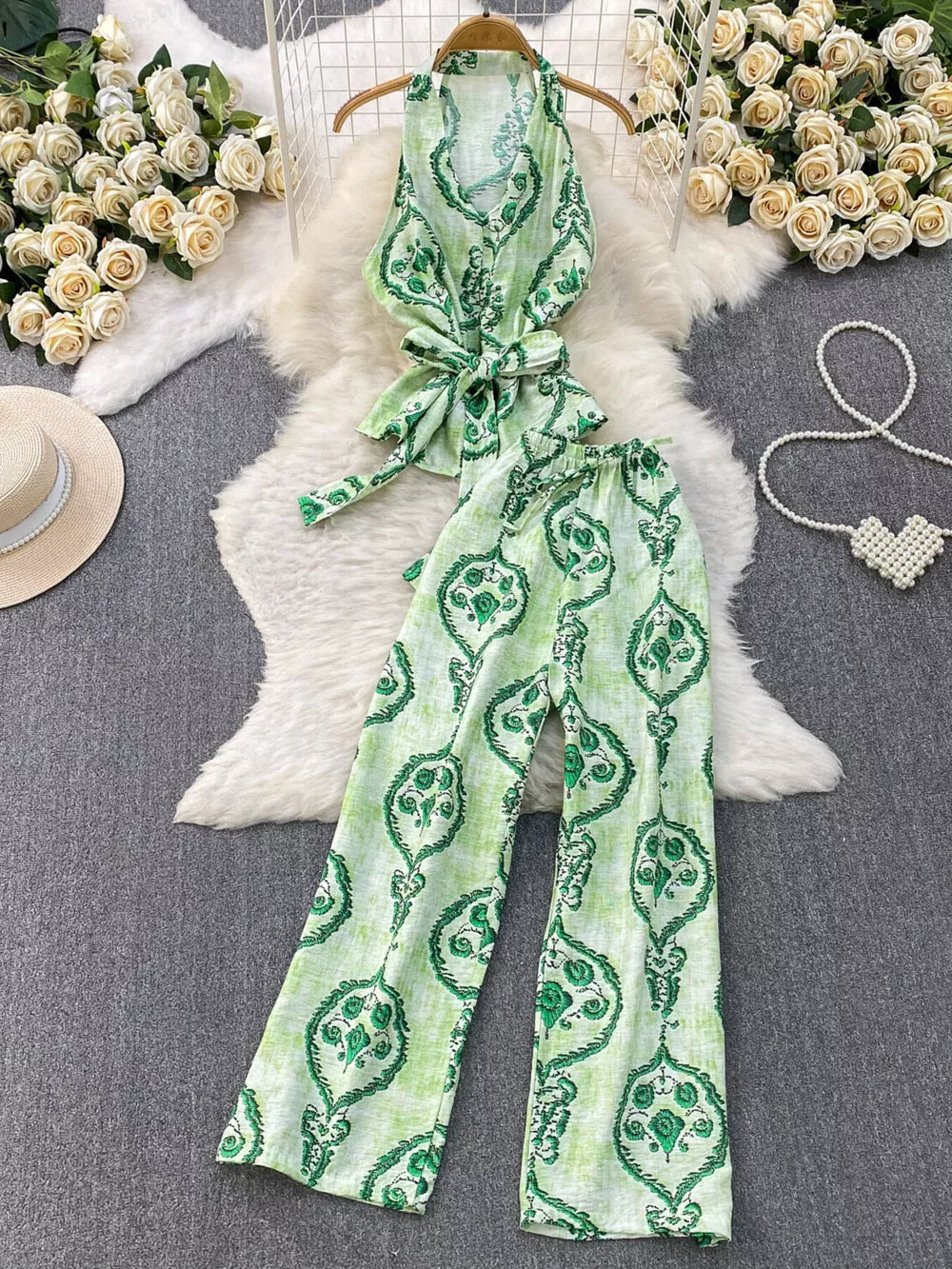 Green tropical print halter top and wide-leg pants set with belted detail