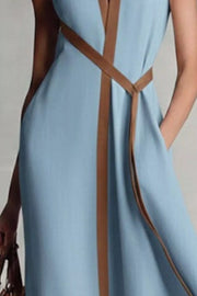 Belted midi dress in dusty blue with elegant contrast trim and tie waist.