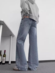 Blue 100% cotton wide-leg jeans with embroidered star details on the hem.