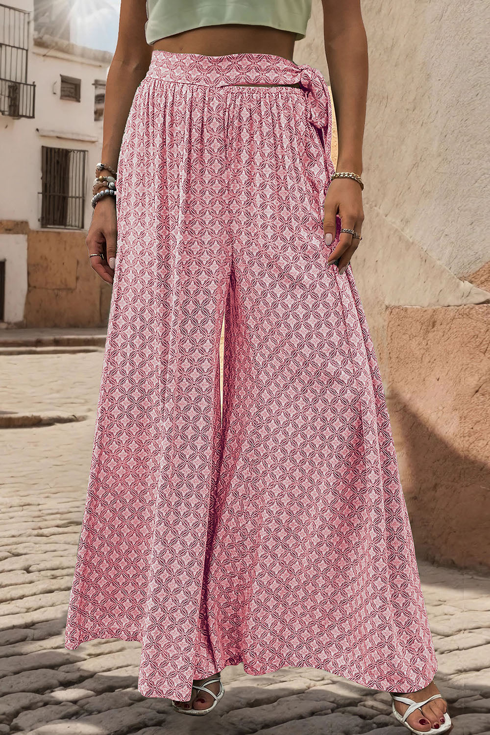 Pink geometric print wide-leg palazzo trousers with a tie waist