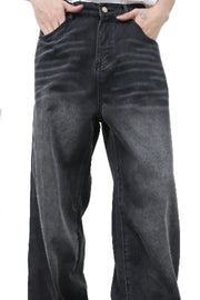 Feline Whisker Denim Jeans in dark gray, featuring a relaxed fit and subtle whiskering details.