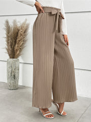 Camel pleated palazzo trousers with a tie waist and wide leg.