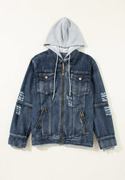 Dark blue denim jacket with grey hooded layer, distressed details and zippered pockets.