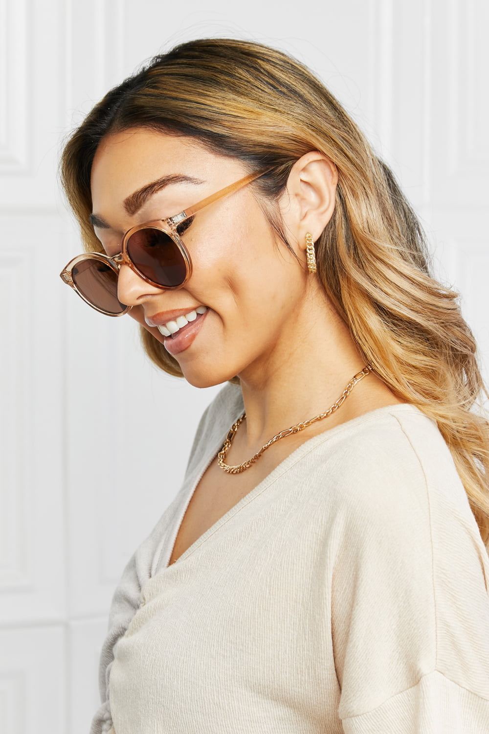 Tortoiseshell round frame sunglasses with tan acetate frames and brown lenses.