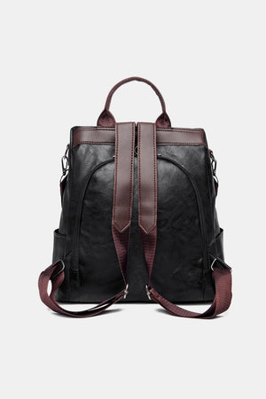 Black structured leather convertible backpack with brown trim and straps